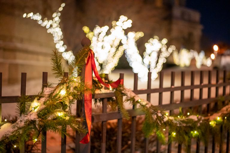Festive garlands and twinkling lights surround the Cathedral courtyard to create the ambiance in the Christmas market.