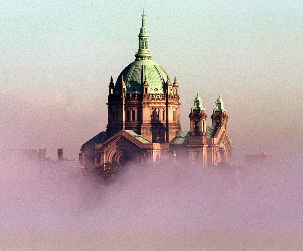 HIGH RISE...... THE RISING FOG FROM THE MISSISSIPPI RIVER NEAR THE HIGH  BRIDGE  CAUSED A CELESTIAL SCENE OF THE CATHEDRAL OF SAINT PAUL, IN SAINT  PAUL, MN.,